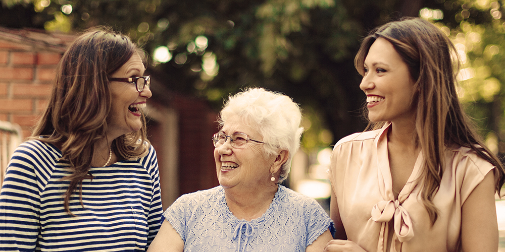 Older woman with two younger women outside Older woman with two younger women outside